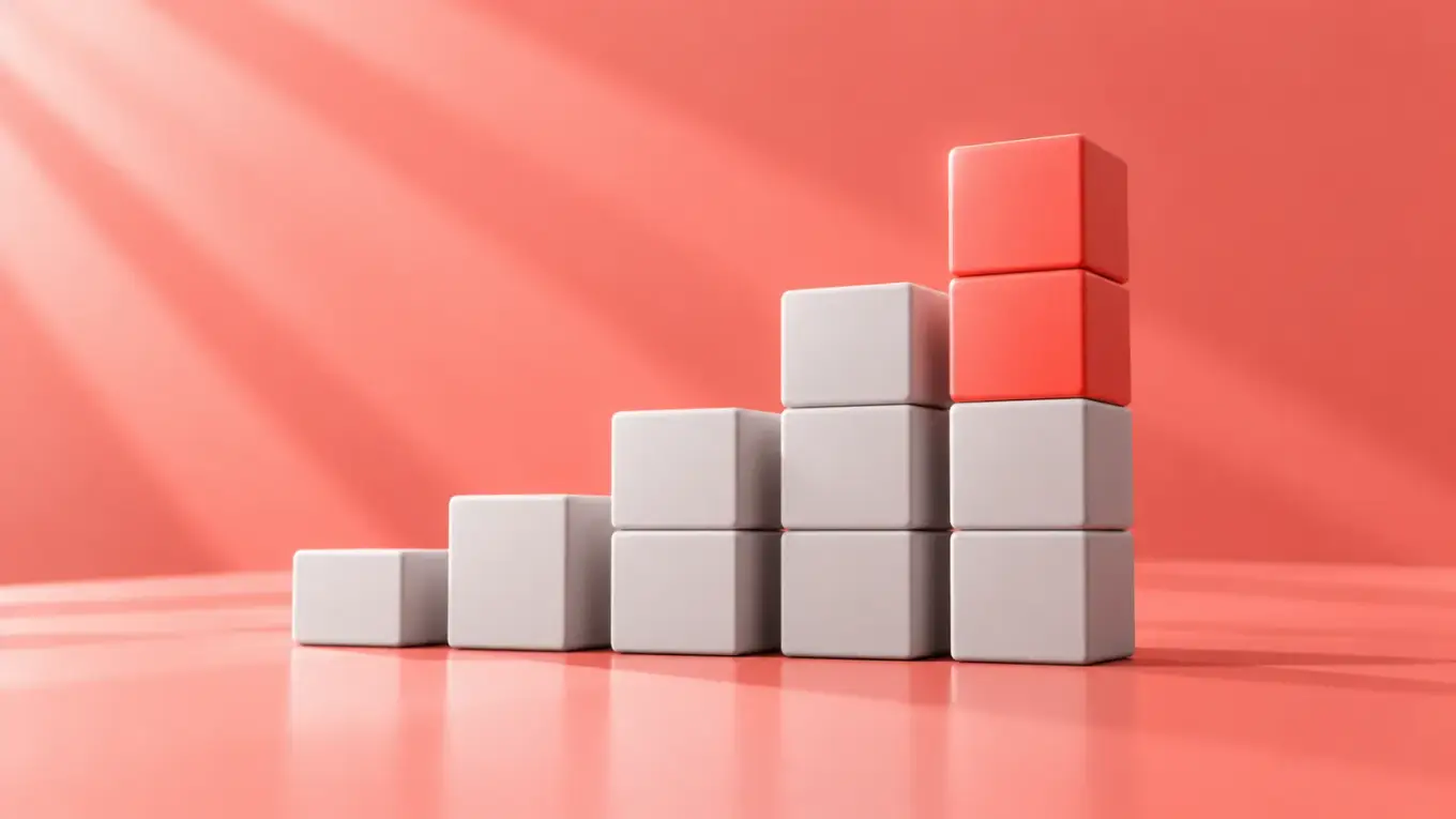 Rising stack of white blocks topped with two coral blocks